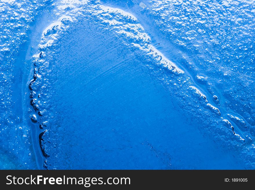 Detail of a bubbled glass with blu natural gradient. Detail of a bubbled glass with blu natural gradient