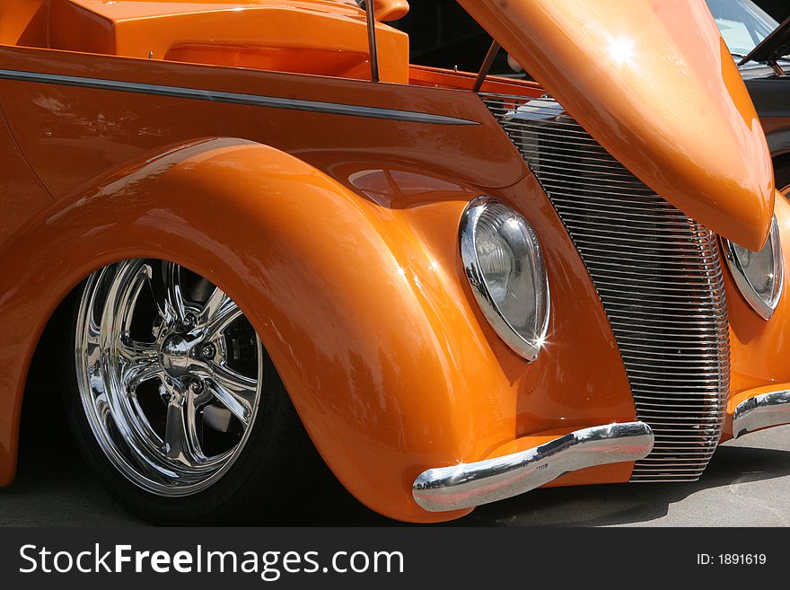 Beautiful orange automobile with shiny chrome accents. Beautiful orange automobile with shiny chrome accents
