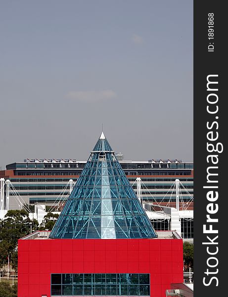 Modern Red Building With Class Cone Roof