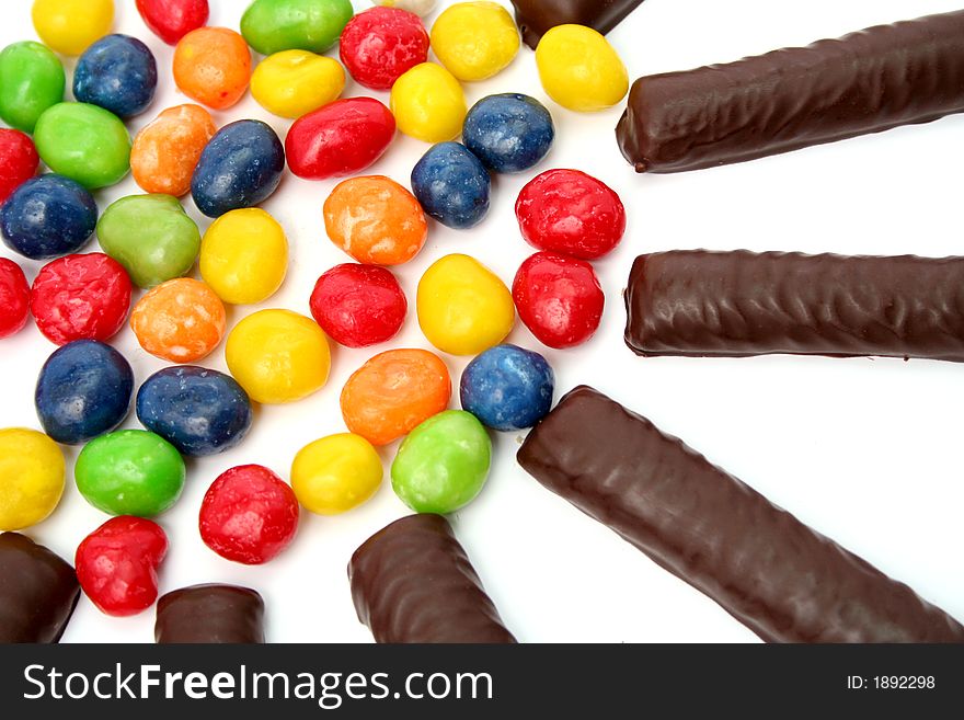 Chocolate sticks with a cream and the multi-coloured sweets isolated, (look similar images in my portfolio)