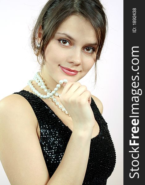 Pretty womans portrait with pearls