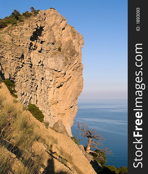 Big rock (Koba-Kaja mount) overhang above the sea (Novyj Svit reserve, Crimea, Ukraine). Big rock (Koba-Kaja mount) overhang above the sea (Novyj Svit reserve, Crimea, Ukraine)