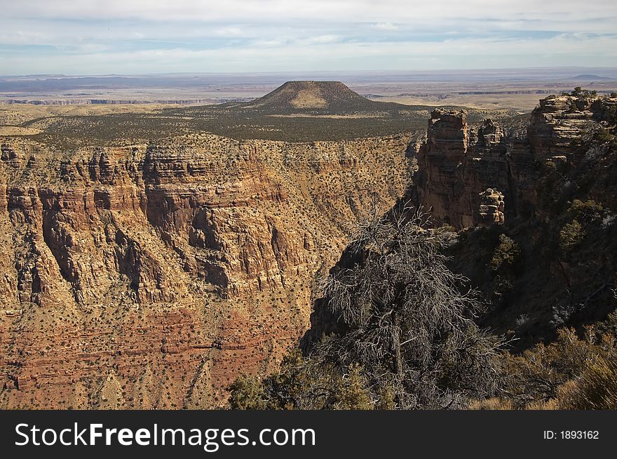 View of Grand Canyon with mountain in background. View of Grand Canyon with mountain in background