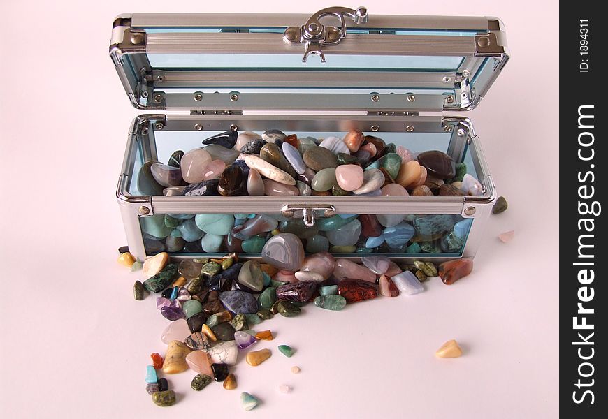 Clear blue treasure chest with gemstones inside and outside. Clear blue treasure chest with gemstones inside and outside