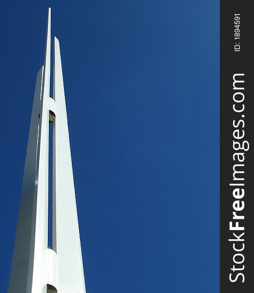 White Steeple Spire against bright blue sky. White Steeple Spire against bright blue sky