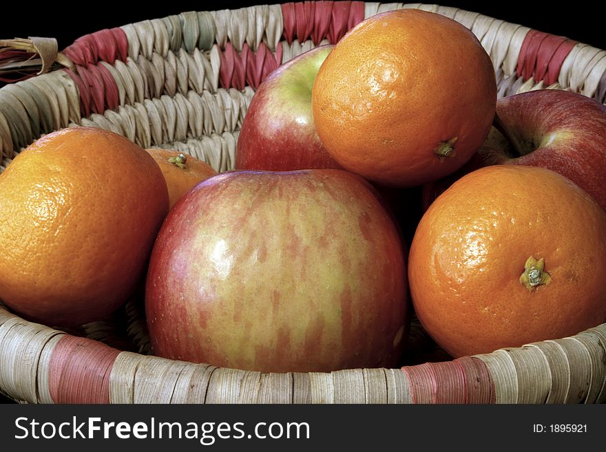 A group of apples and oranges from the local market. A group of apples and oranges from the local market