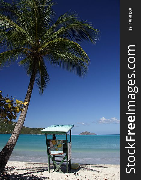 Watchout tower and palm on a caribbean beach. Watchout tower and palm on a caribbean beach