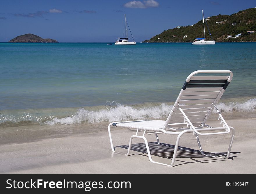 Deck chair on a caribbean beach. Deck chair on a caribbean beach