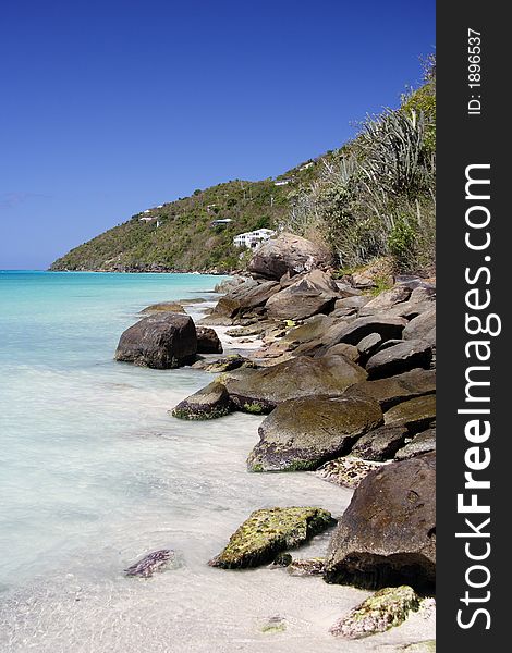 Beautiful caribbean shoreline with granite rocks