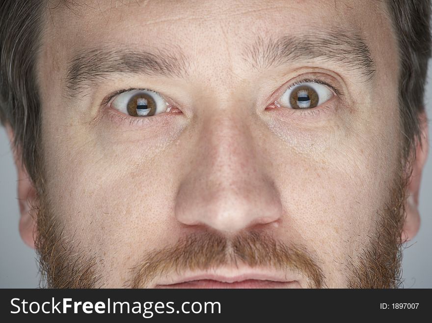 Close up of man starring into camera. Close up of man starring into camera.