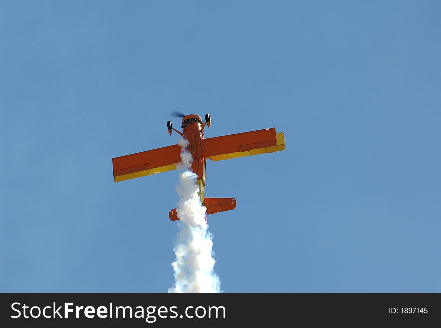 Bi-Plane performing an act at a local Air Show. Bi-Plane performing an act at a local Air Show