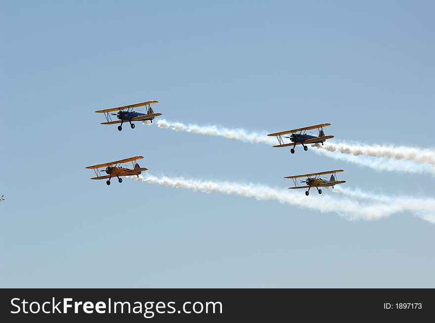 Four Aircraft in formation with smoke on. Four Aircraft in formation with smoke on