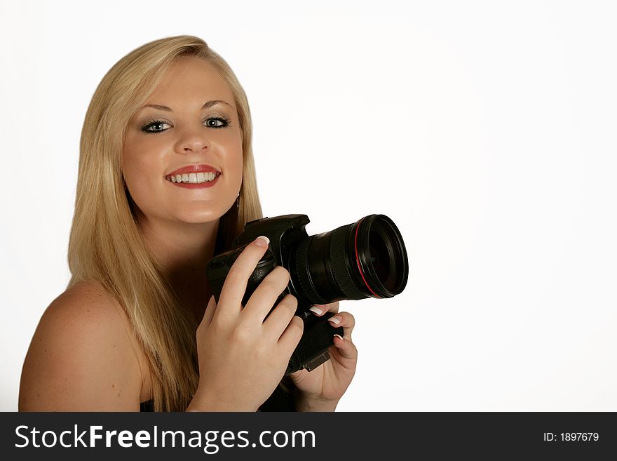 A woman holding a digital camera in her hands. A woman holding a digital camera in her hands