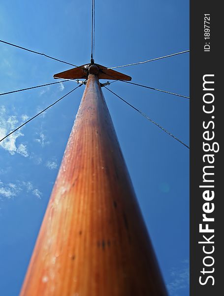 Wooden mast on clear sky