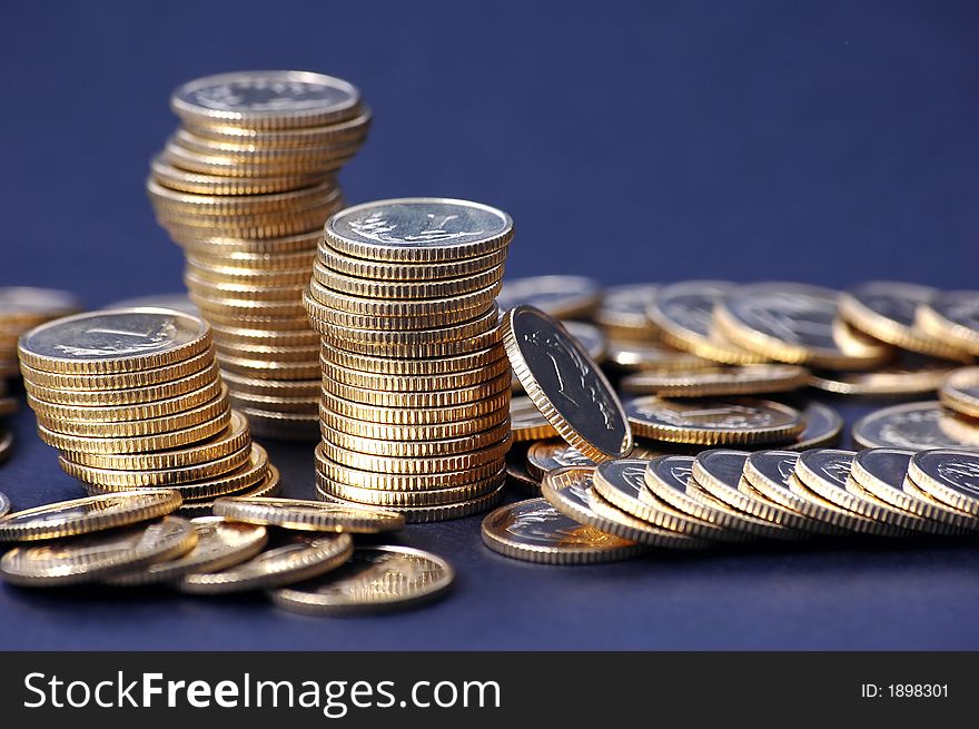 Pile of coins on dark background