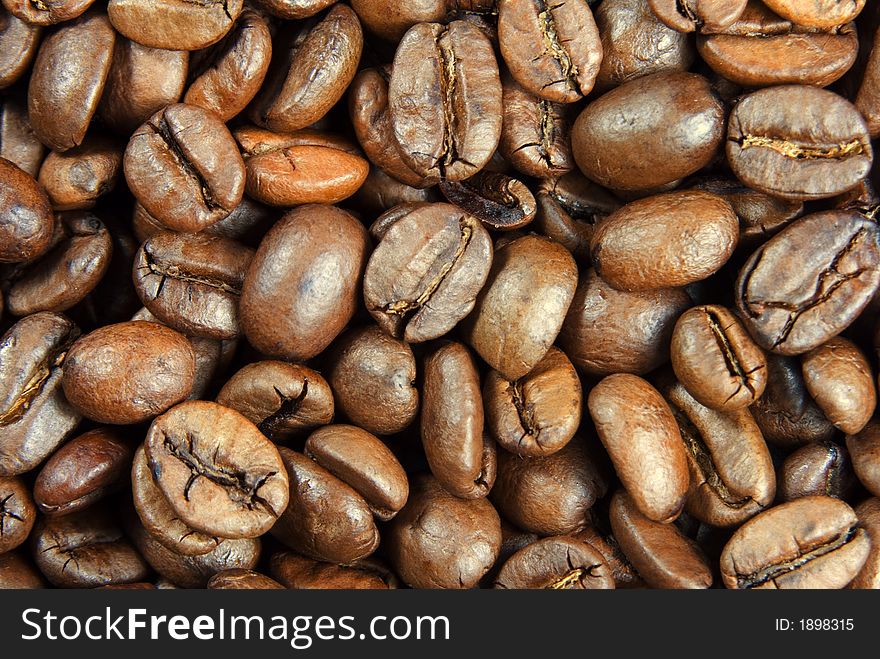Extreme close-up view of beans of coffee. Extreme close-up view of beans of coffee