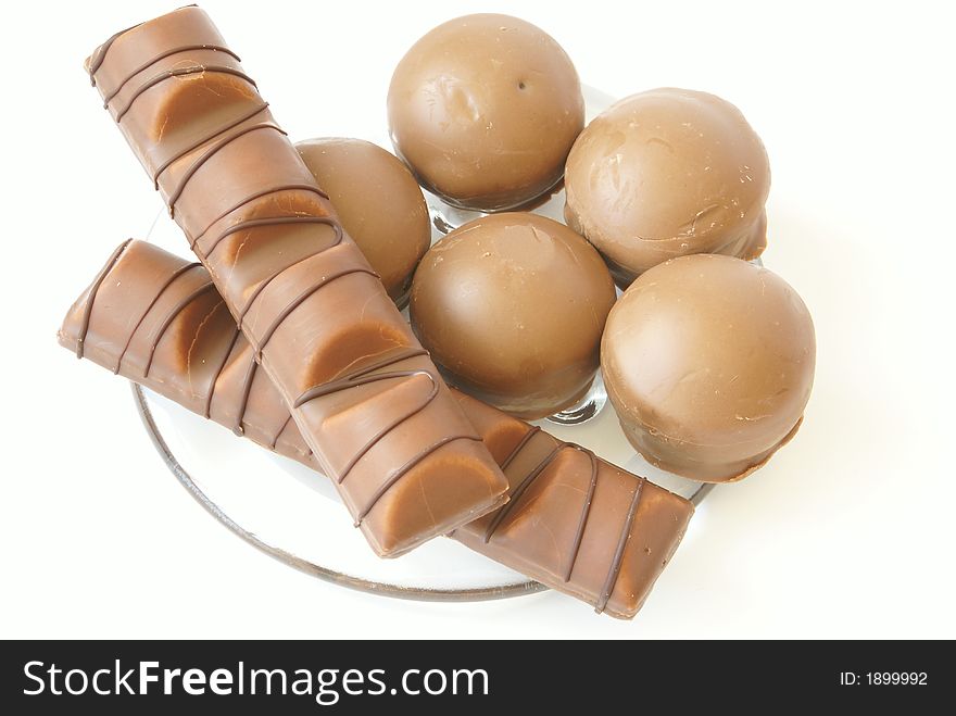 Tasty chocolate candies close-up isolated on white.