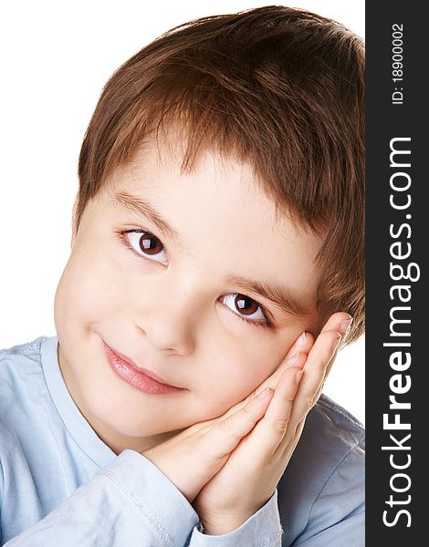 Close-up portrait of beautiful smiling little boy with hands near his face isolated on white background. Close-up portrait of beautiful smiling little boy with hands near his face isolated on white background
