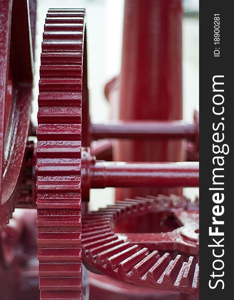 Red cog wheels in an old crane. Red cog wheels in an old crane