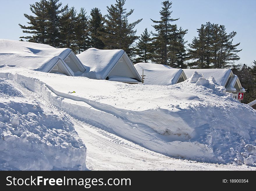 Two homes almost buried in snow following a heavy winter storm. Two homes almost buried in snow following a heavy winter storm.