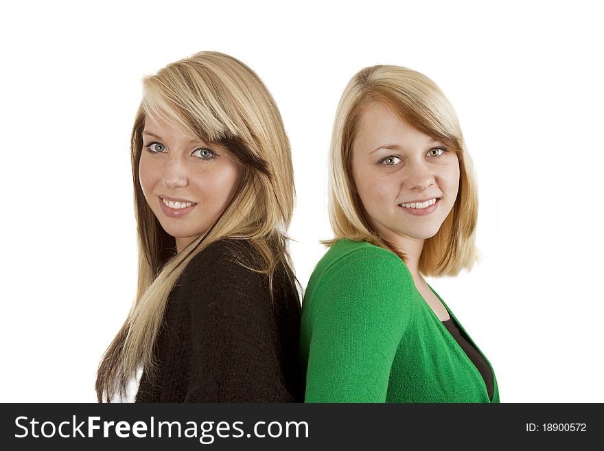 Two young caucasian girlfriends having fun together  isolated over white background. Two young caucasian girlfriends having fun together  isolated over white background