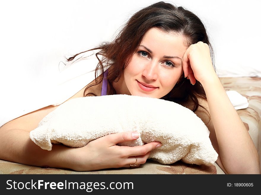Portrait of beautiful girl in the morning in bed on white background. Portrait of beautiful girl in the morning in bed on white background