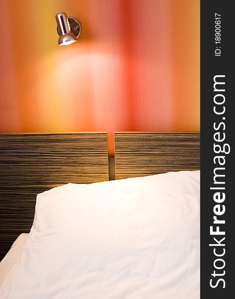 Colorful Bedroom interior with turn-on lamp and bed