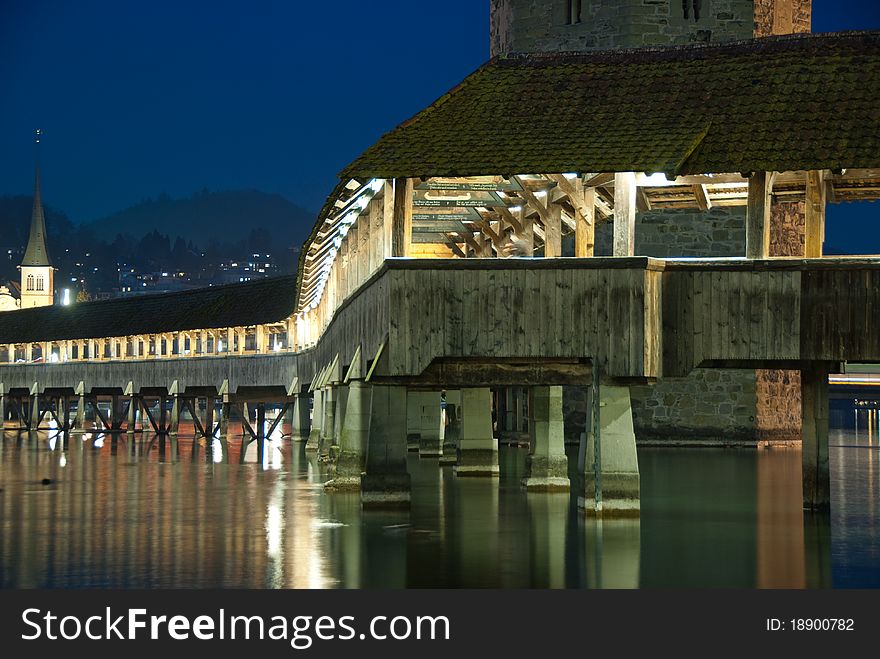 The Chapel Bridge in Lucerne, illuminated by night. The Chapel Bridge in Lucerne, illuminated by night