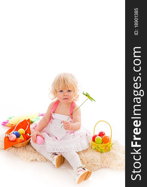 Blonde haires little girl with easter eggs