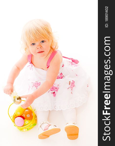 Blonde haires little girl with easter eggs