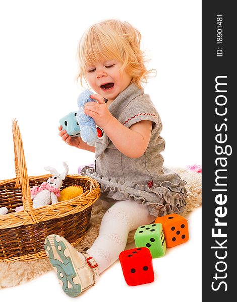 Little blonde haired girl playing with toys. Little blonde haired girl playing with toys