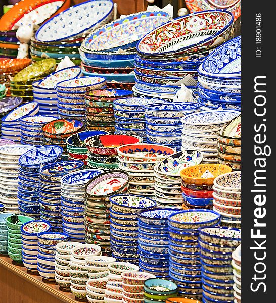 Decorated ottoman style ceramic plates and bowls in a turkish market stall. Decorated ottoman style ceramic plates and bowls in a turkish market stall