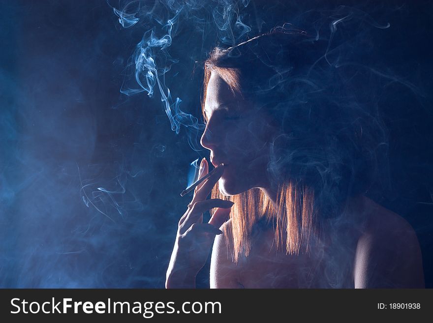 The Girl Smokes A Cigarette