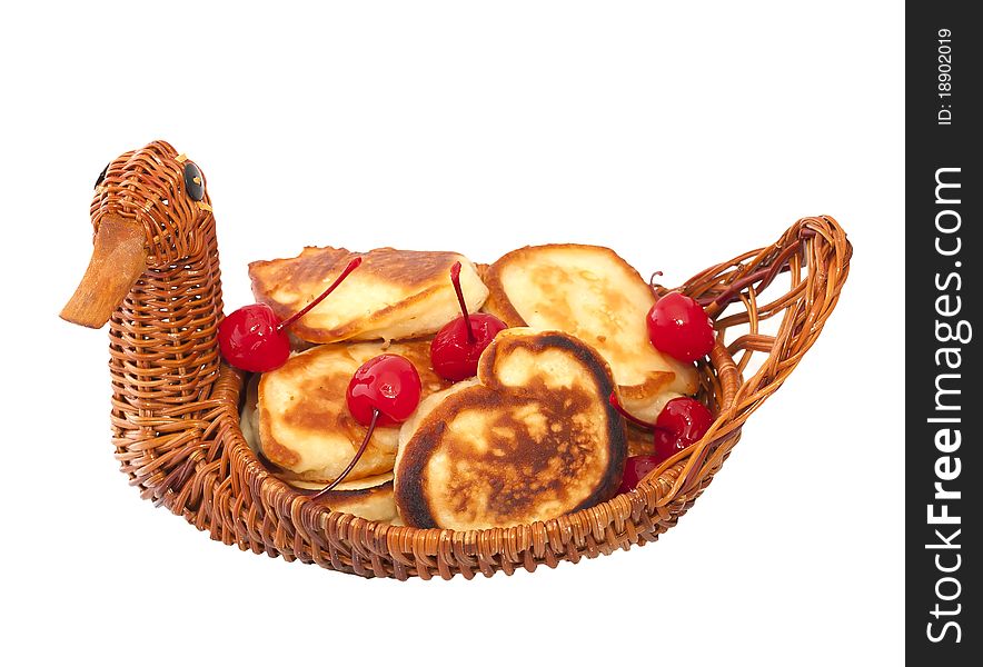 Fried donuts in a wicker basket isolated
