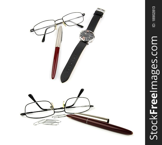 Glasses, pen, watch and paper-clip isolated on white background. Glasses, pen, watch and paper-clip isolated on white background.