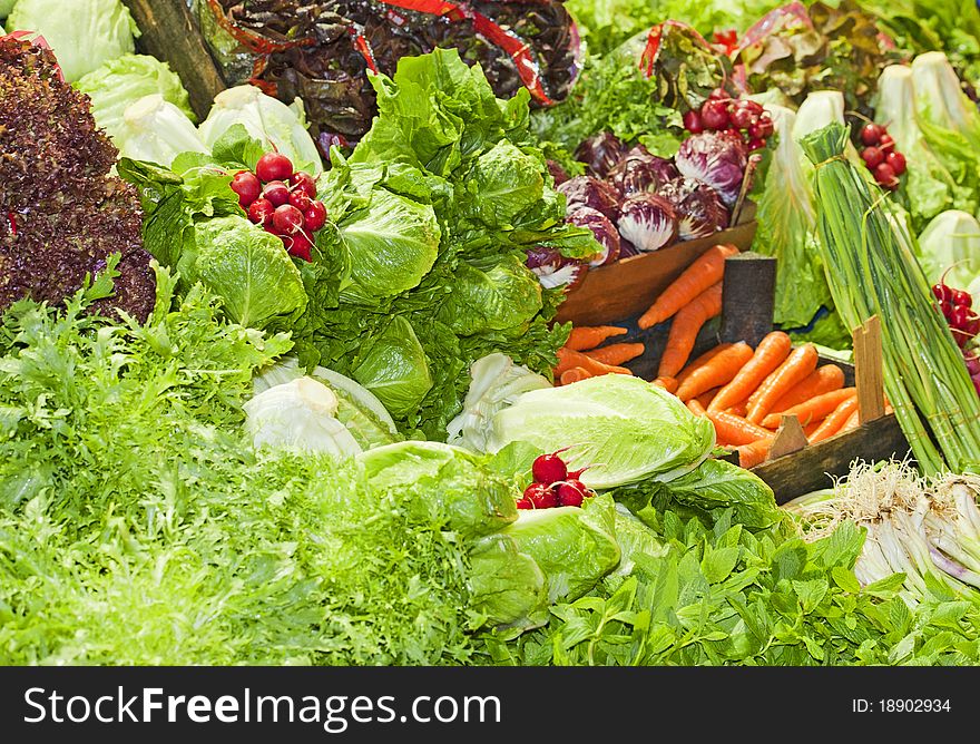 Collection of fresh vegetables for sale at a market stall. Collection of fresh vegetables for sale at a market stall