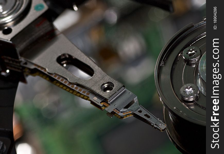 High-tech electronic circuits are reflected on the surface of a hard disk drive platter. High-tech electronic circuits are reflected on the surface of a hard disk drive platter.