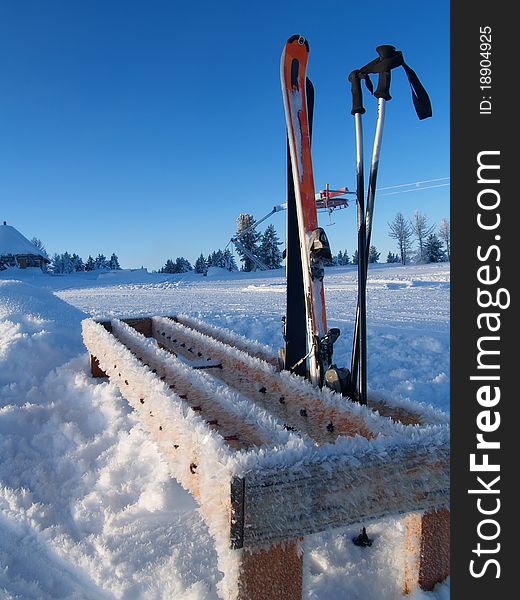 Ski rack on top of a mountain on the background of snow and sky