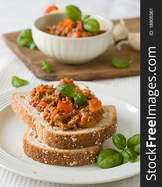 Sandwich of savory ground beef on toasted wholewheat bread. A delicious variety of a Sloppy Joe. Sandwich of savory ground beef on toasted wholewheat bread. A delicious variety of a Sloppy Joe.