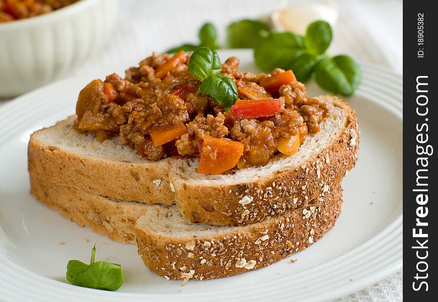 Sandwich of savory ground beef on toasted wholewheat bread. A delicious variety of a Sloppy Joe. Sandwich of savory ground beef on toasted wholewheat bread. A delicious variety of a Sloppy Joe.