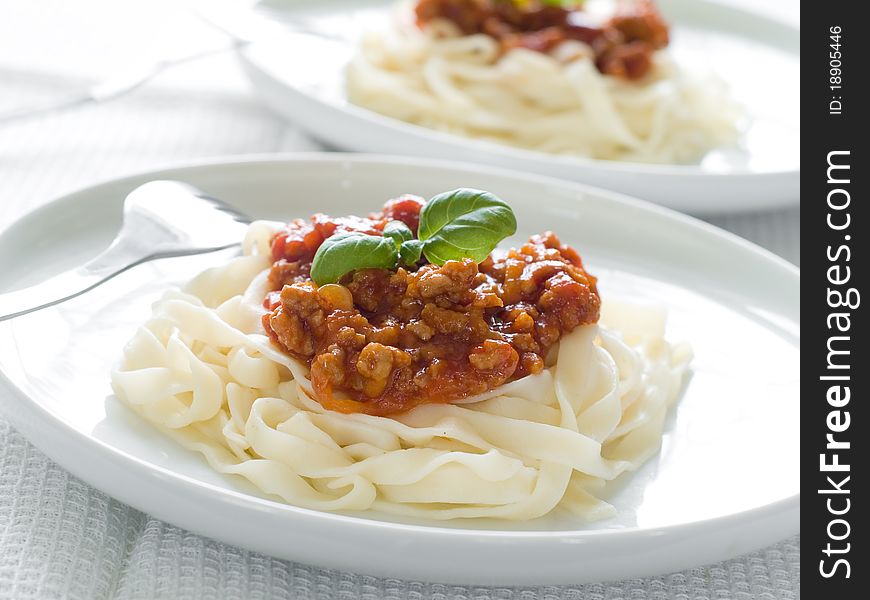 Pasta with bolognese sauce and basil