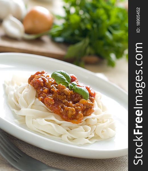 Pasta with bolognese sauce and basil