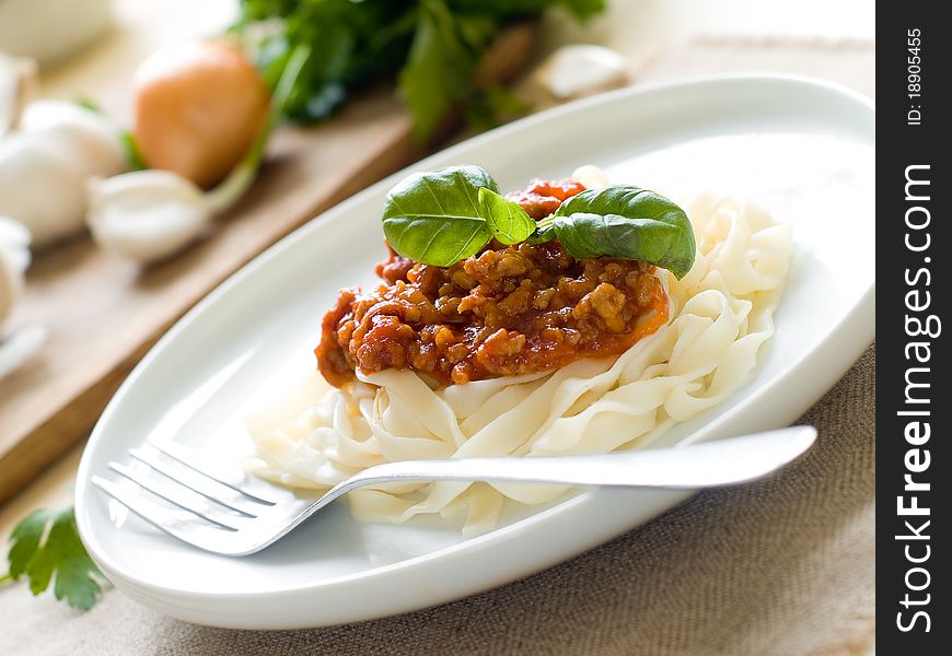 Pasta with bolognese sauce and basil
