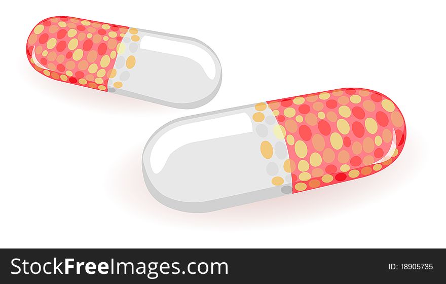 Two  pills is isolated on a white background. Two  pills is isolated on a white background
