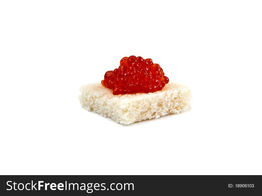 Close-up red caviar on bread isolated on white background. Close-up red caviar on bread isolated on white background