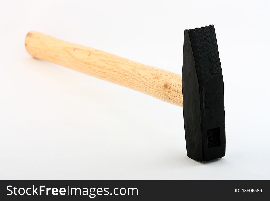 Hammer on neutral background; construction theme