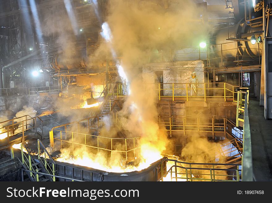 Molten hot steel pouring inside of plant