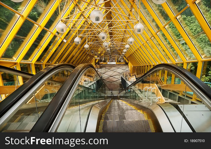 Escalator to the pedestrian bridge over the river