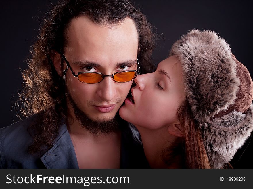 Sexy young couple. Posing in a studio