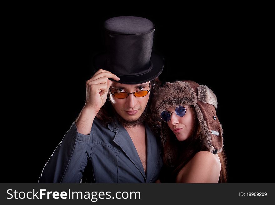 young couple in a different hats. young couple in a different hats